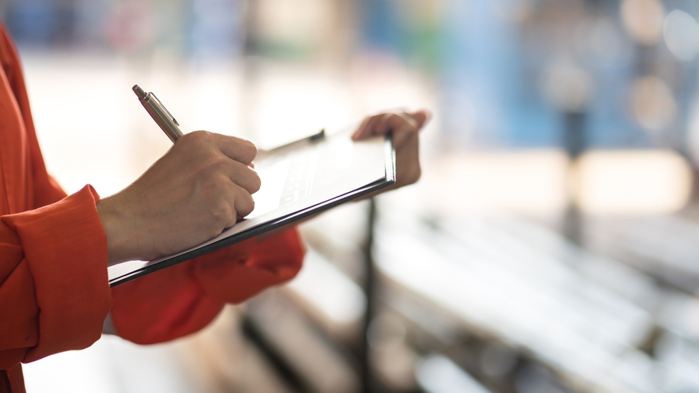 Businessperson with checklist on clipboard