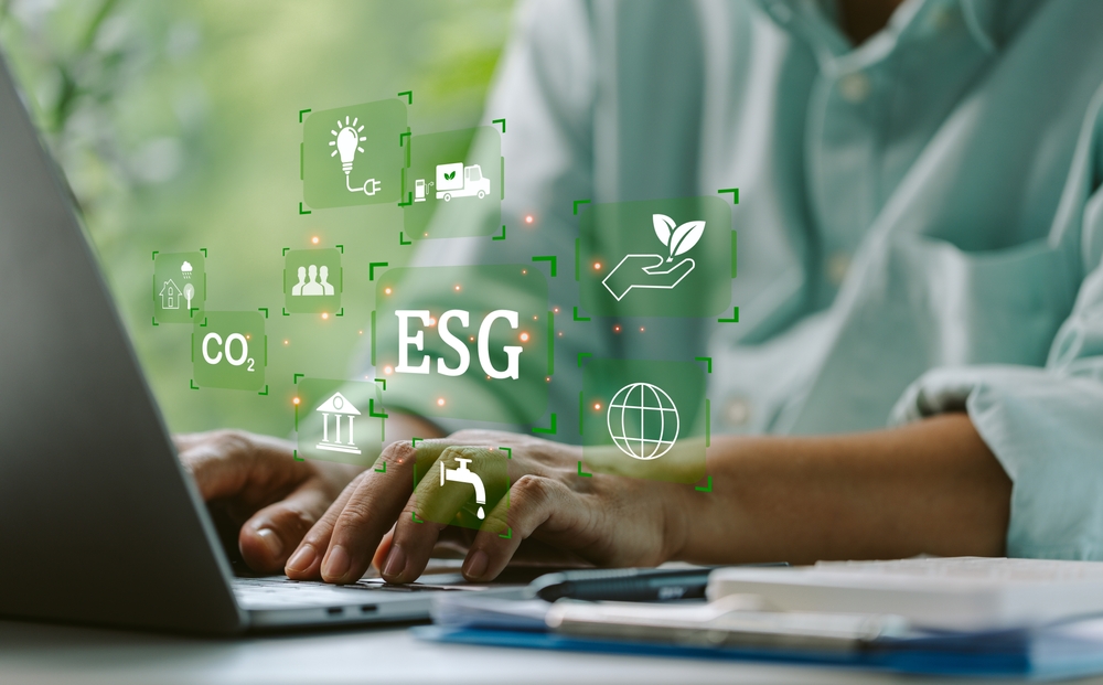 ESG and hands typing on keyboard concept